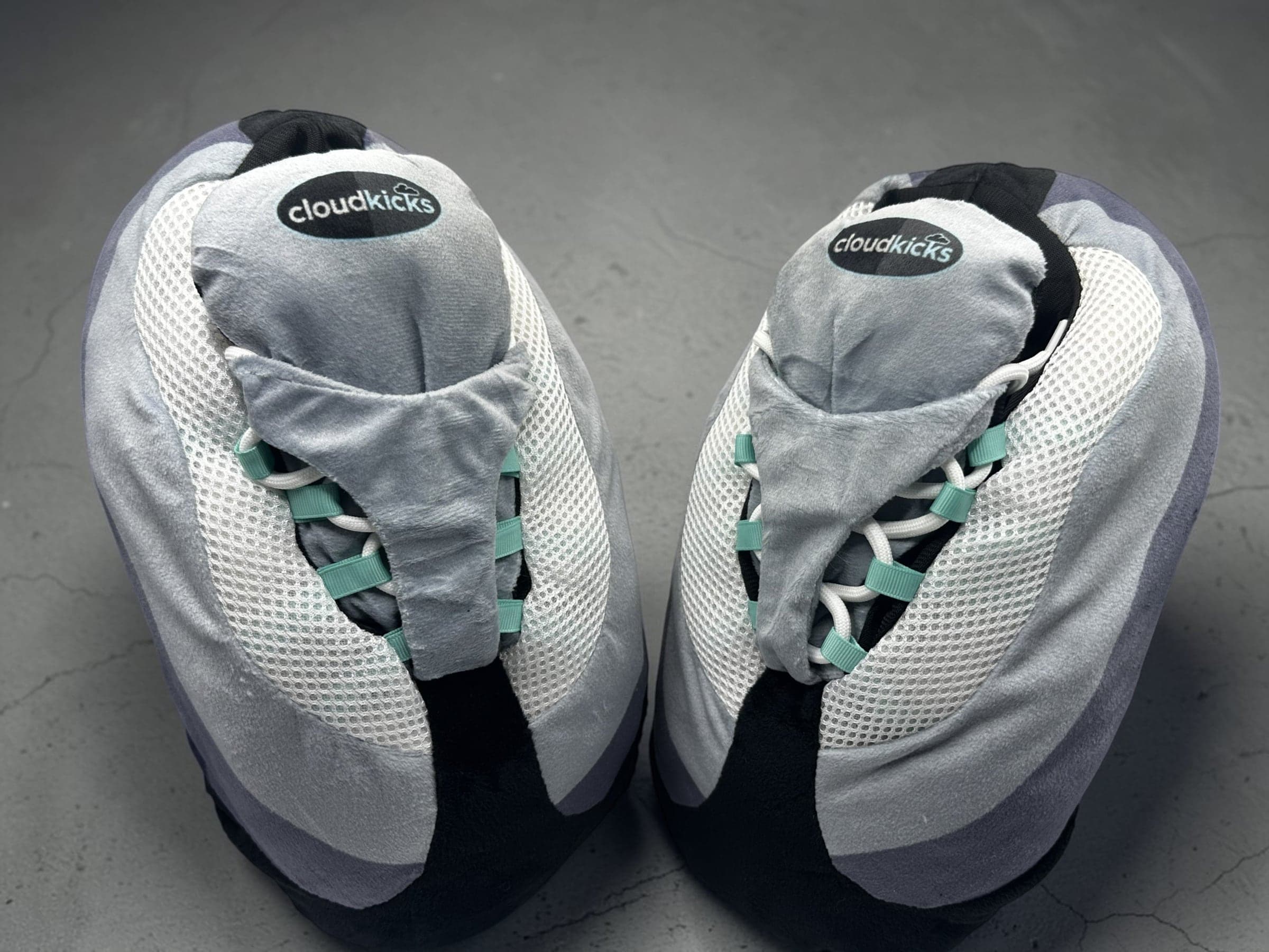 Pair of Hyper Turquoise CloudKicks from the front