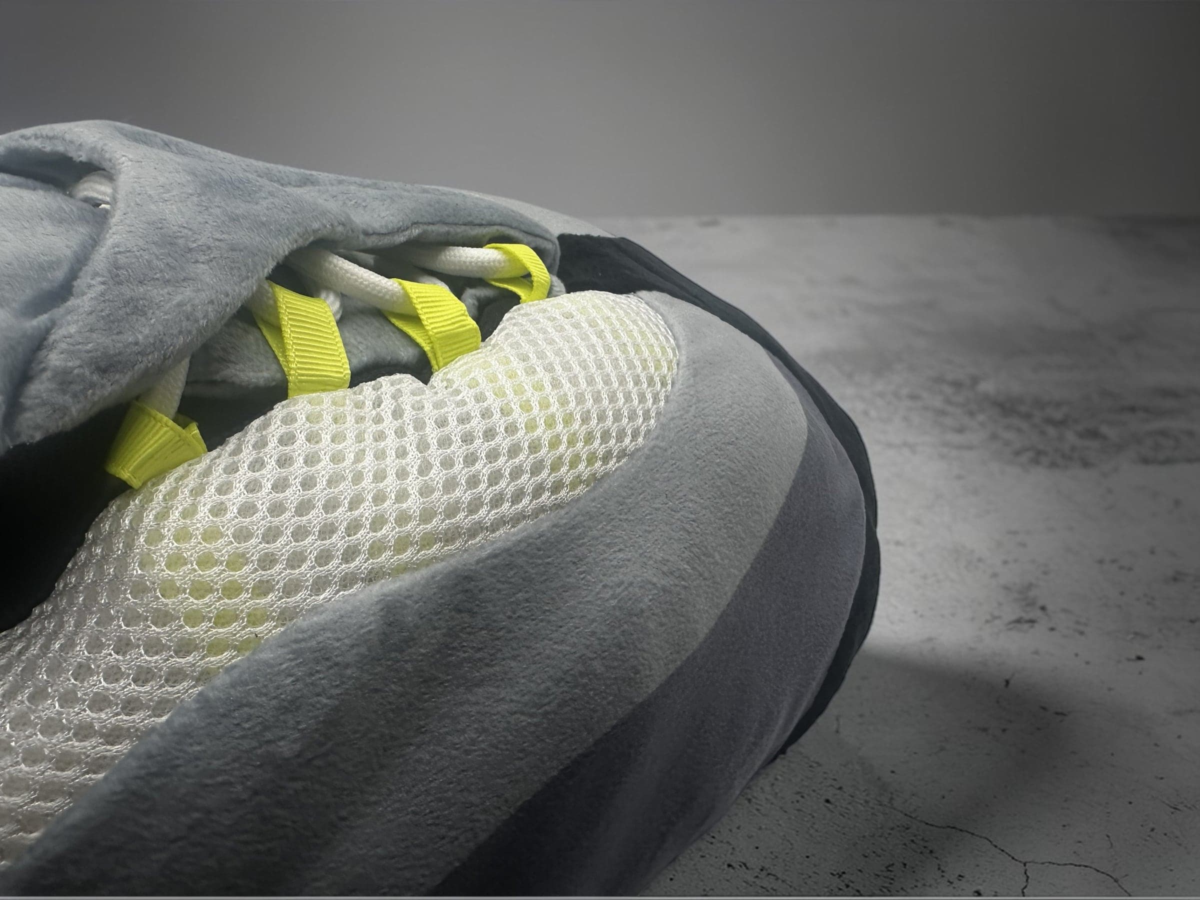 Close-up of neon lace loops and white rope laces