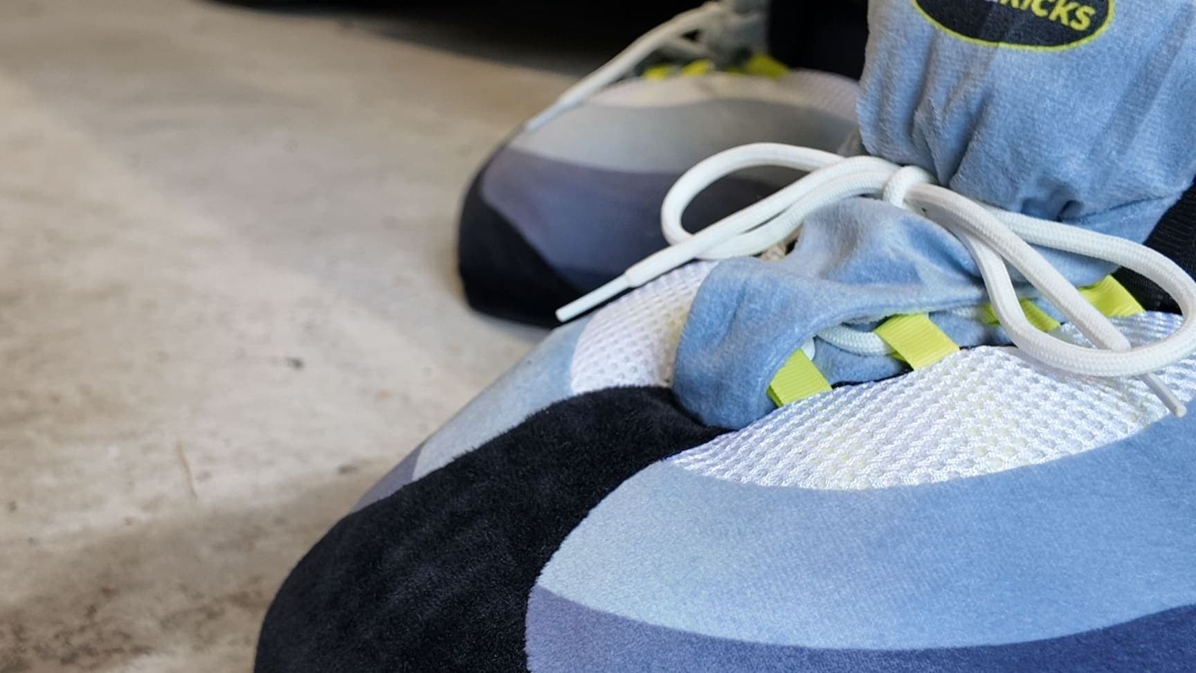 Close-up of an OG Neon CloudKick on a concrete garage floor